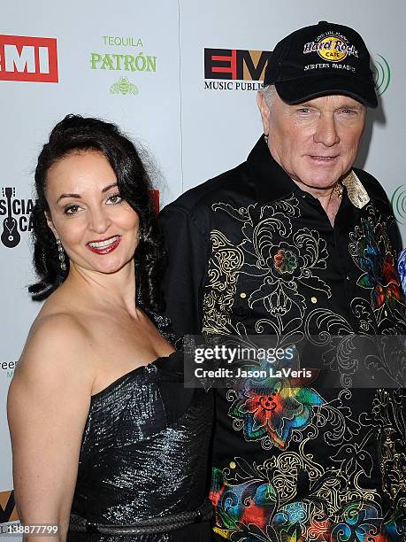 Mike Love of The Beach Boys and wife Jacqueline Piesen attend the EMI Grammy after party on February 12, 2012 in Hollywood, California.