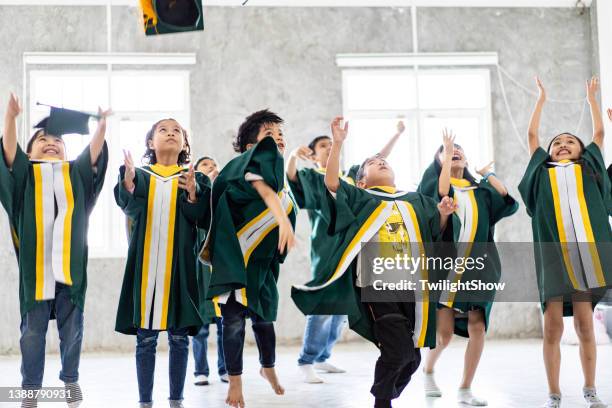 Kindergarten Graduation Caps And Gowns Photos and Premium High Res ...
