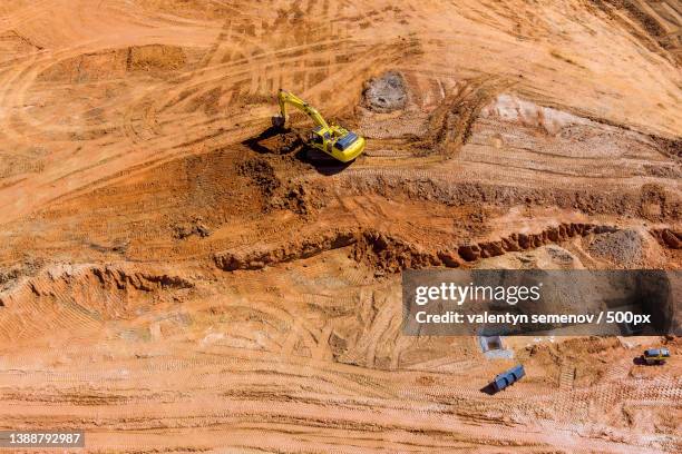 aerial view of excavator at construction of water main,sanitary sewer - archaeological dig stock pictures, royalty-free photos & images