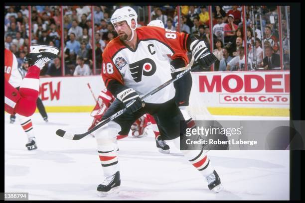 Center Eric Lindros of the Philadelphia Flyers moves down the ice during Game 1 of the Stanley Cup Finals against the Detroit Red Wings at the...