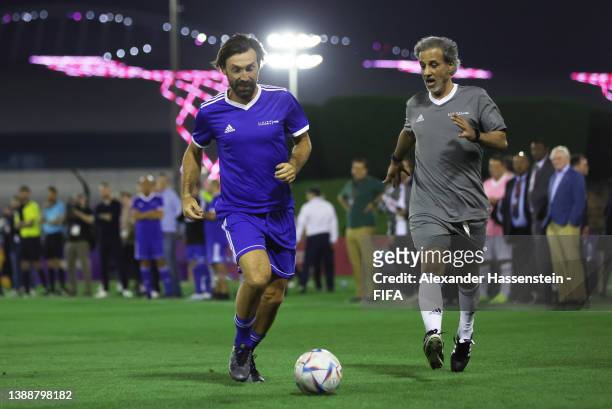 Andrea Pirlo of Team FIFA and Sheikh Hamad Bin Khalifa Bin Ahmed Al-Thani, President of the Qatar Football Association in action during the 72nd FIFA...