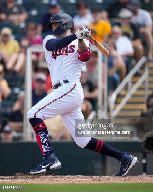 Carlos Correa of the Minnesota Twins bats during a spring training game against the Pittsburgh Pirates on March 30, 2022 at the Hammond Stadium in...