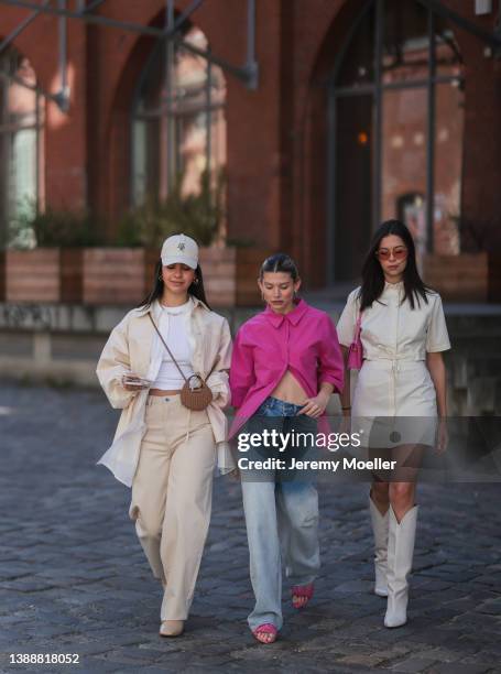 Bella Emar wearing a creme cap from LeGer, a white basic top, a white blouse shirt from LeGer, a creme beige denim LeGer jacket, a matching creme...