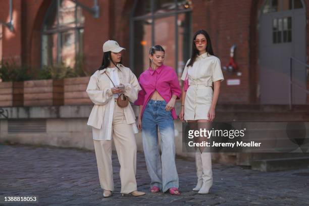Bella Emar wearing a creme cap from LeGer, a white basic top, a white blouse shirt from LeGer, a creme beige denim LeGer jacket, a matching creme...
