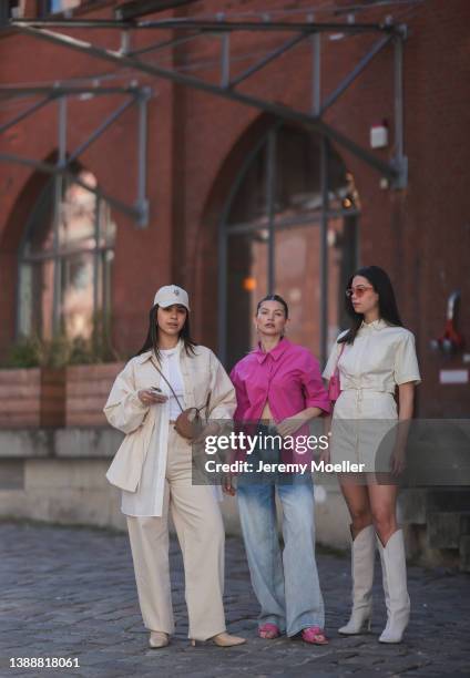 Bella Emar wearing a creme cap from LeGer, a white basic top, a white blouse shirt from LeGer, a creme beige denim LeGer jacket, a matching creme...