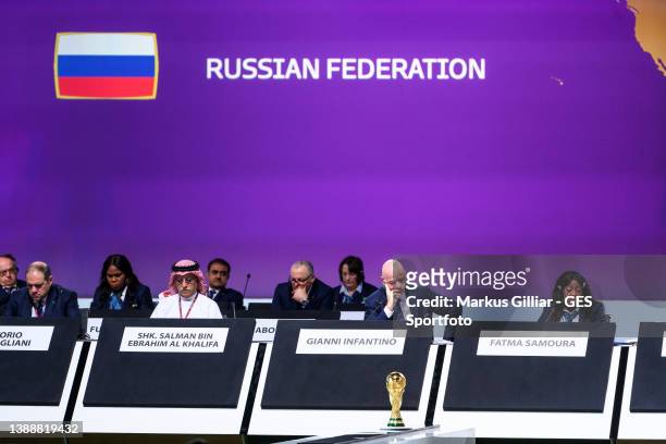 President Gianni Infantino and Fatma Samba Diouf Samoura are sitting on the podium with the flag of the Russian Federation in the background during...