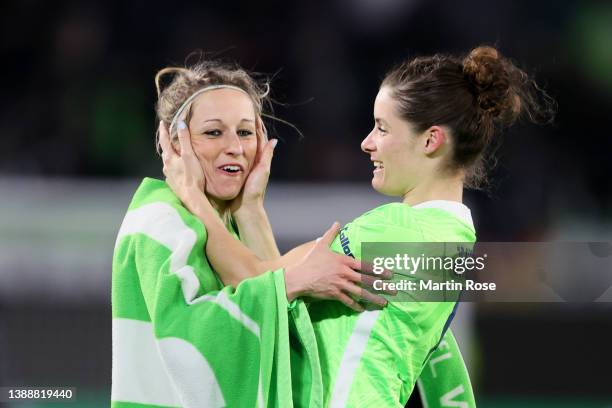 Svenja Huth and Dominique Janssen of VfL Wolfsburg celebrate following their side's victory in the UEFA Women's Champions League Quarter Final Second...