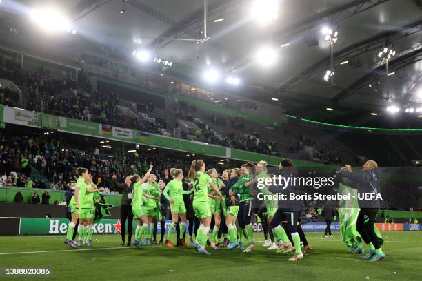 Players of VfL Wolfsburg celebrate following their side's victory in the UEFA Women's Champions League Quarter Final Second Leg match between VfL...