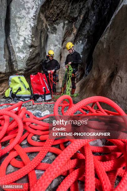 canyoneering members seen in a canyon - pioneer photographer of motion stock pictures, royalty-free photos & images