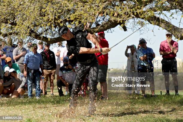 Rory McIlroy of Northern Ireland plays his shot on the 18th hole during the first round of the Valero Texas Open at TPC San Antonio on March 31, 2022...