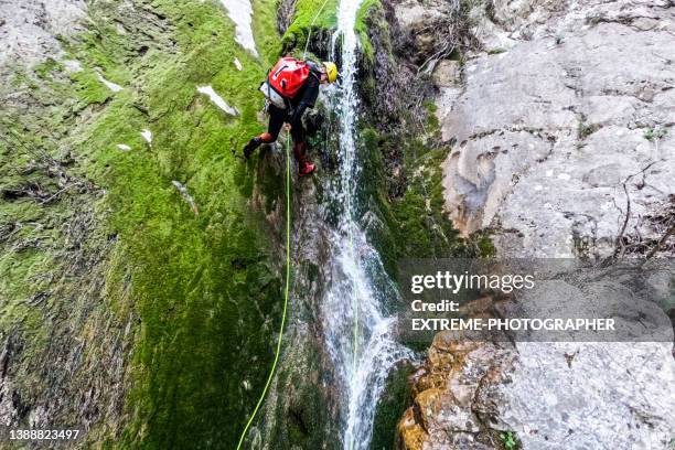 extreme canyoning adventure in untouched nature - pioneer photographer of motion stock pictures, royalty-free photos & images