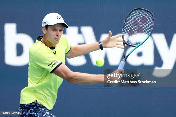 Hubert Hurkacz of Poland returns a shot to Daniil Medvedev of Russia during the Miami Open at Hard Rock Stadium on March 31, 2022 in Miami Gardens,...