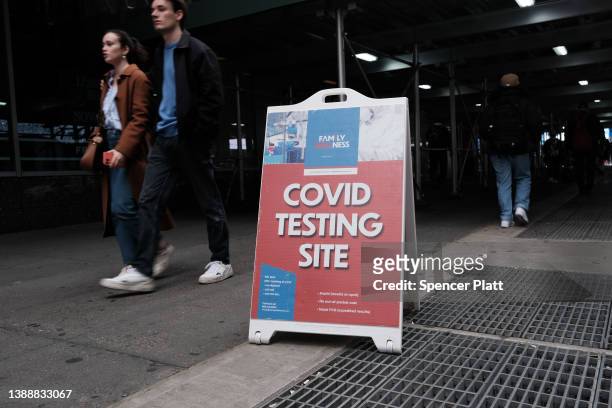 People walk by a COVID-19 testing site in downtown Manhattan on March 31, 2022 in New York City. New York City Mayor Eric Adams has said that remote...