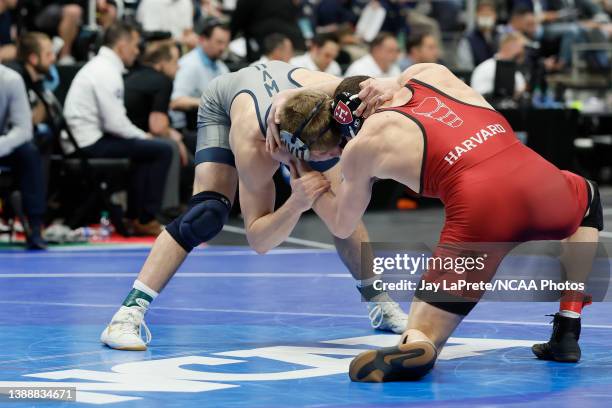 Philip Conigliaro of the Harvard Crimson wrestles Peyton Hall of the West Virginia Mountaineers during the Division I Men's Wrestling Championship...
