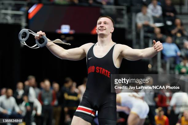 Gavin Hoffman of the Ohio State Buckeyes celebrates his win over Jake Woodley of the Oklahoma Sooners in the 197-pound weight class during the...