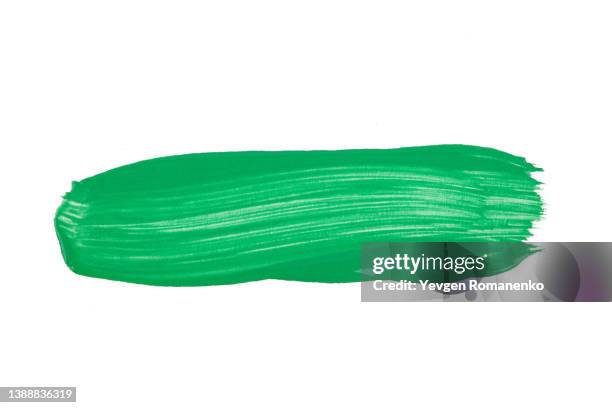 green brush stroke isolated on white background - tinta imagens e fotografias de stock