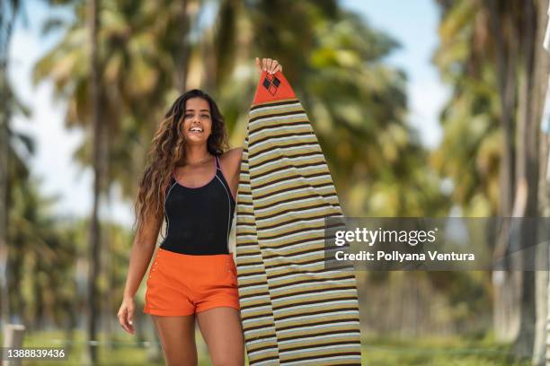 woman with surfboard - beach holding surfboards stock pictures, royalty-free photos & images