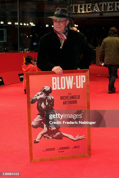 Festival director Dieter Kosslick holds a poster reading "Blow up" prior the "L'Enfant d'en haut" Premiere during day five of the 62nd Berlin...