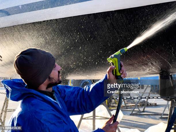 boat cleaning before summer. - repairing boat stock pictures, royalty-free photos & images
