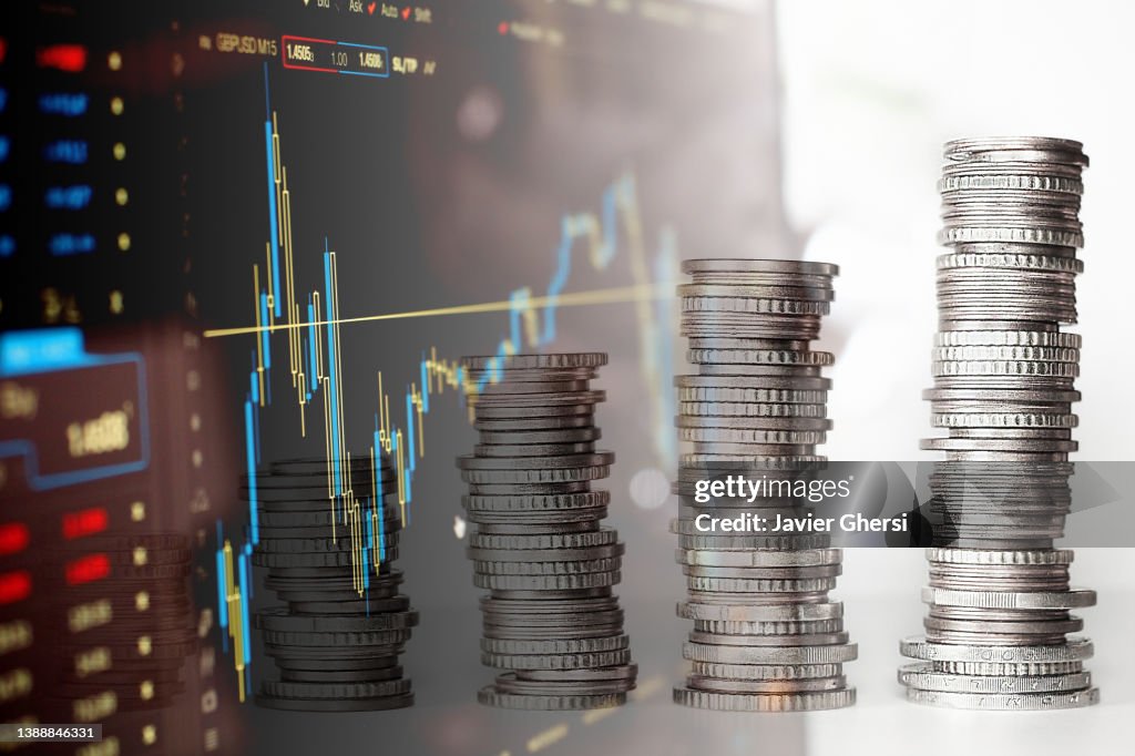 Economy Graph: Stacked Coins and Stock Market Indicators
