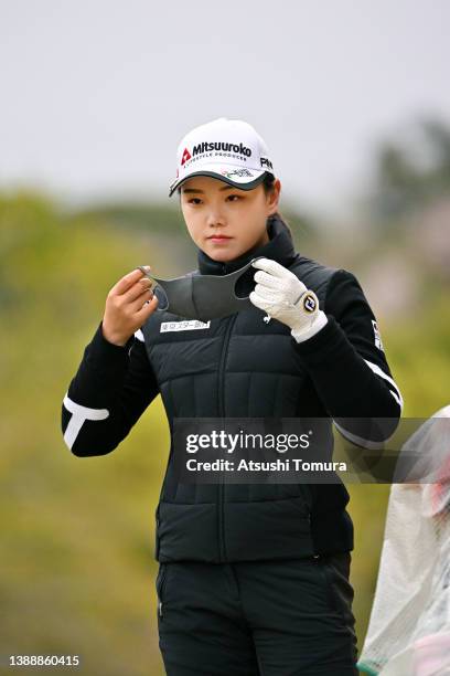 Yuting Seki of China adjusts her face mask on the 7th tee during the second round of Yamaha Ladies Open Katsuragi at Katsuragi Golf Club Yamana...