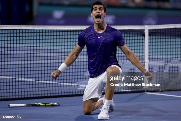 Carlos Alcaraz of Spain celebrates match point against Miomir Kecmanovic of Serbia during quarterfinals of the Miami Open at Hard Rock Stadium on...
