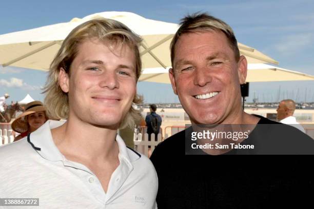 Jackson Warne and his father Shane Warne attend Twilight Beach Polo on February 05, 2022 in St Kilda, Australia.