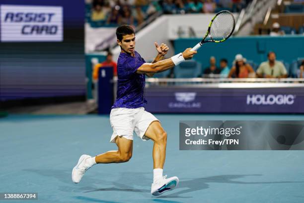 Carlos Alacraz of Spain hits a forehand against Miomir Kecmanovic of Serbia in the quarter finals of the men's singes at the Miami Open at the Hard...