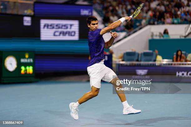 Carlos Alacraz of Spain hits a forehand against Miomir Kecmanovic of Serbia in the quarter finals of the men's singes at the Miami Open at the Hard...