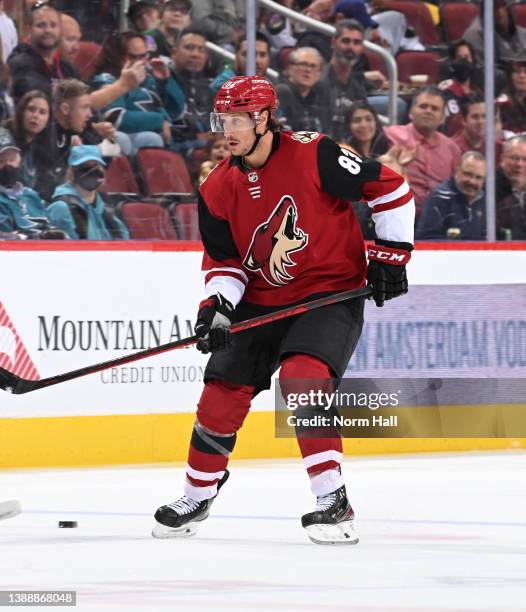 Jay Beagle of the Arizona Coyotes passes the puck against the San Jose Sharks at Gila River Arena on March 30, 2022 in Glendale, Arizona.