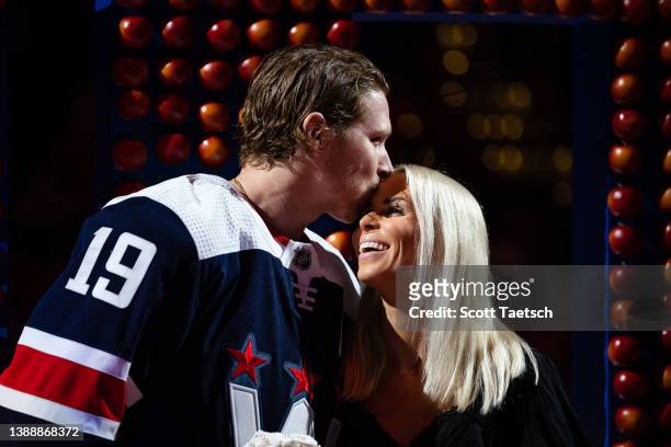 March 26: Nicklas Backstrom of the Washington Capitals kisses his fiance Liza Berg during a pregame ceremony for recording his 1,000th NHL point...