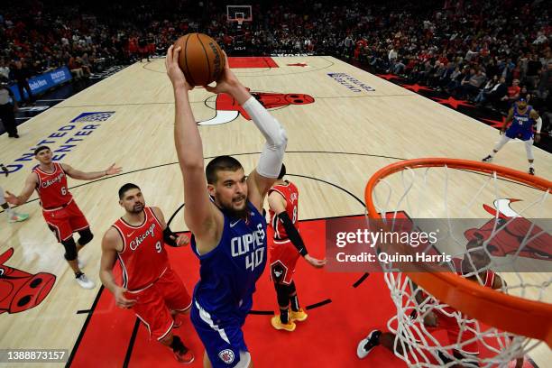 Ivica Zubac of the Los Angeles Clippers goes up to dunk in the second half against the Chicago Bulls at United Center on March 31, 2022 in Chicago,...