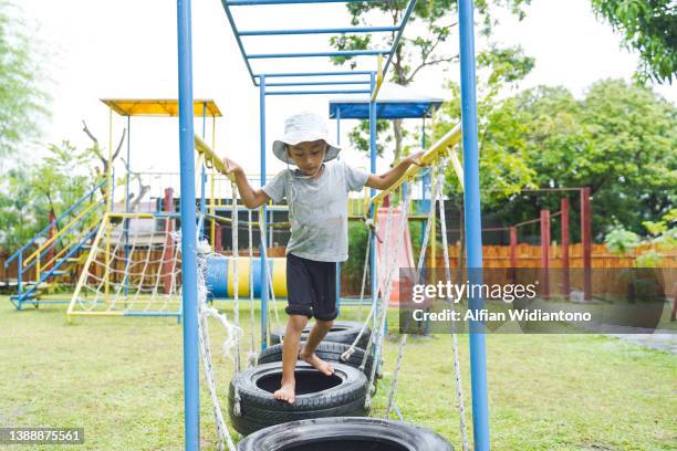 young boy having fun - kids fun indonesia stock pictures, royalty-free photos & images