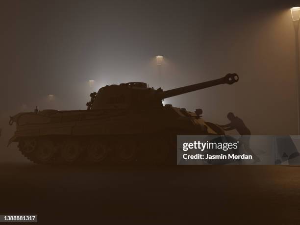 man against tank, peace against war madness concept - march madness stockfoto's en -beelden