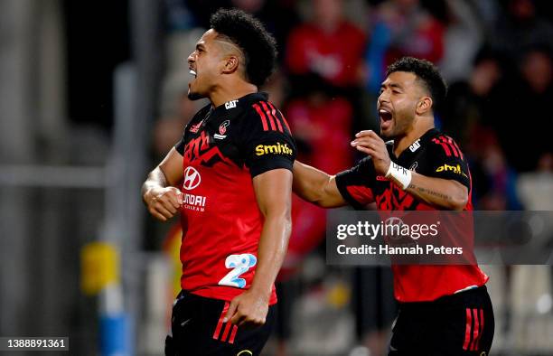 Leicester Fainga'anuku of the Crusaders celebrates his try with Richie Mo'unga during the round seven Super Rugby Pacific match between the Crusaders...