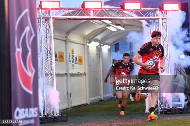 Scott Barrett of the Crusaders leads the team out during the round seven Super Rugby Pacific match between the Crusaders and the Highlanders at...