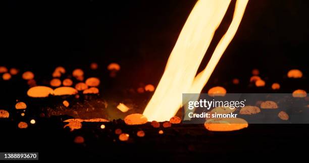 pouring molten steel - molten stock pictures, royalty-free photos & images