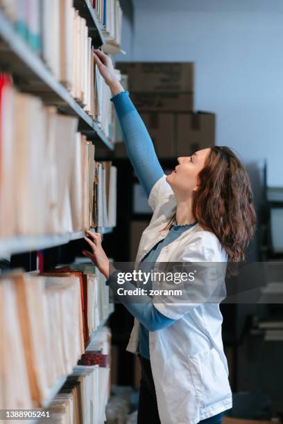 Reaching Books 50 Reaching To High Shelf Stock Photos, High-Res Pictures, and Images ...