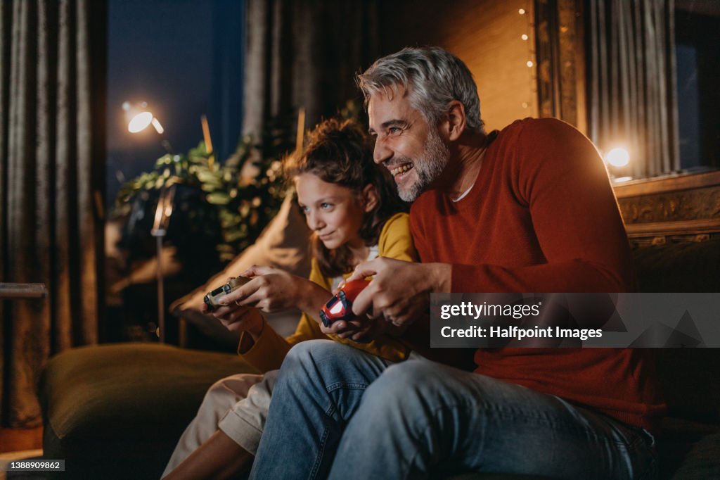Family playing video games. Family bonding activities.
