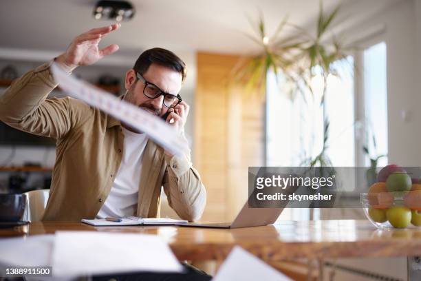 frustrated entrepreneur talking on cell phone at home office. - throwing phone stock pictures, royalty-free photos & images