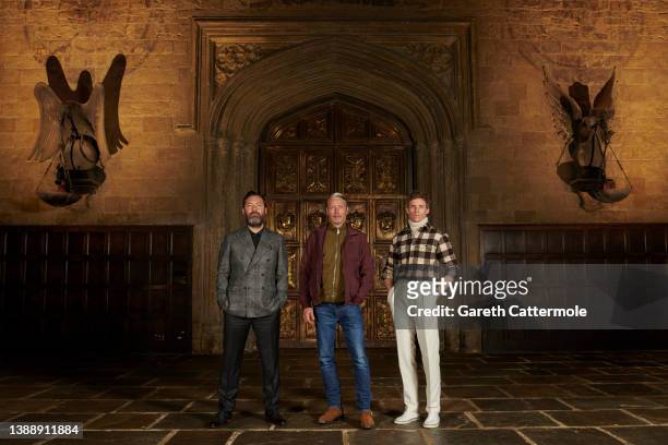 Jude Law, Mads Mikkelsen and Eddie Redmayne attend a photocall for "Fantastic Beasts: The Secrets of Dumbledore" in the Great Hall at Warner Bros....