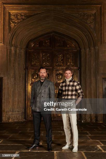 Jude Law and Eddie Redmayne attend a photocall for "Fantastic Beasts: The Secrets of Dumbledore" in the Great Hall at Warner Bros. Studio Tour London...