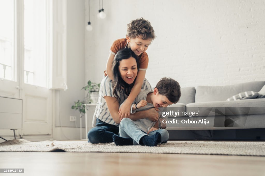 Mother playing with sons