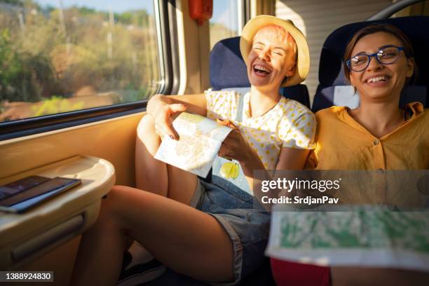 cheerful female friend stravel together with train - carruagem imagens e fotografias de stock