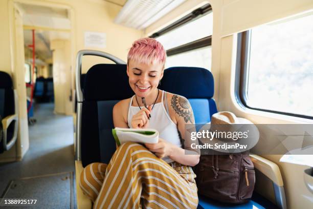 creative caucasian female tourist, drawing in her notebook while travel - travel writer stock pictures, royalty-free photos & images