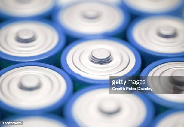 blue batteries close up - lithium ion battery stock pictures, royalty-free photos & images