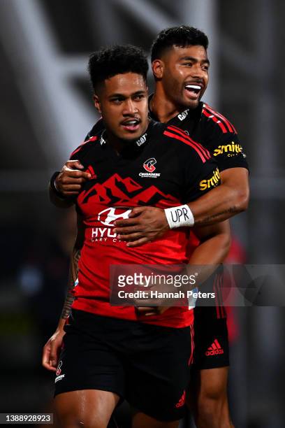 Leicester Fainga'anuku of the Crusaders celebrates after scoring a try with Richie Mo'unga during the round seven Super Rugby Pacific match between...