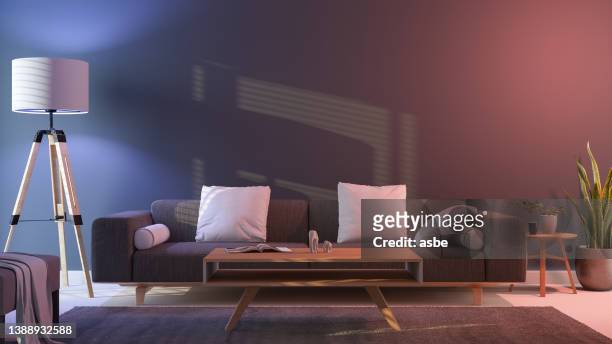 modernes wohnzimmerinterieur bei nacht mit bunten neonlichtern - contemporary living space stock-fotos und bilder