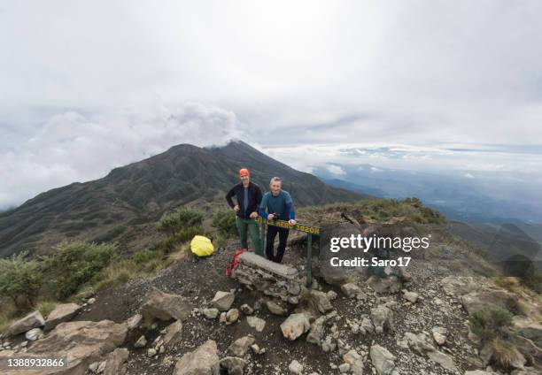 on the summit of little mount meru, tanzania. - arusha region stock pictures, royalty-free photos & images