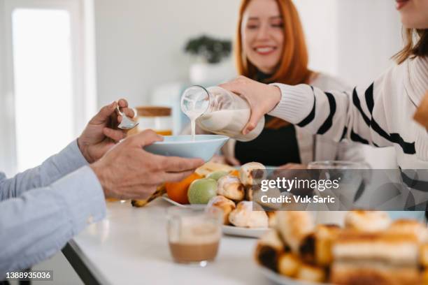 pouring almond milk over cereals - pouring cereal stock pictures, royalty-free photos & images